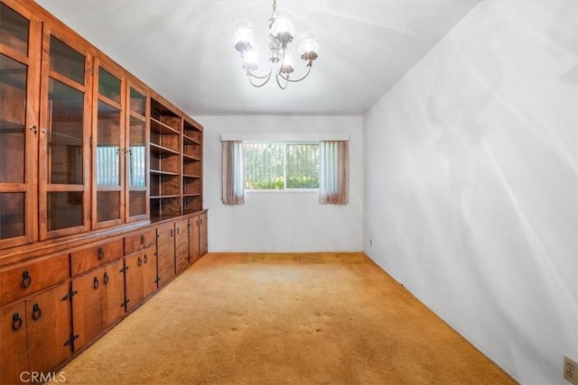13411 Wingo St, Arleta, CA 91331 - unfurnished room with light colored carpet and a chandelier