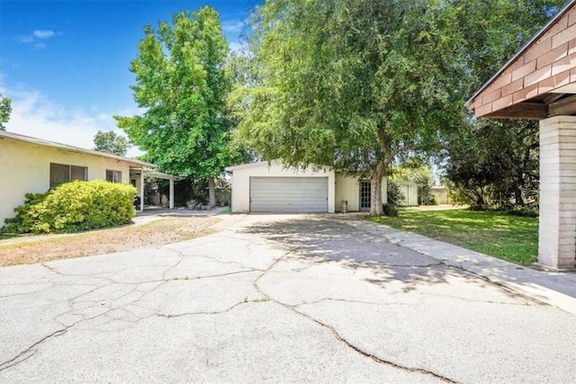 13411 Wingo St, Arleta, CA 91331 - view of front of property with driveway, stucco siding, a front lawn, and an attached garage