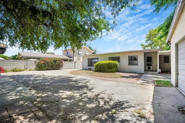 13411 Wingo St, Arleta, CA 91331 - view of front of house featuring stucco siding and a patio area