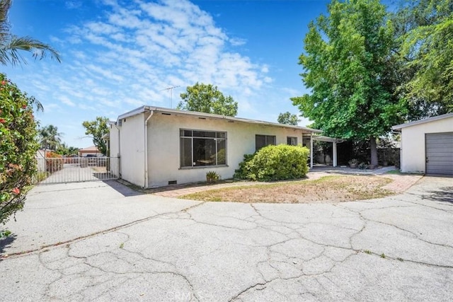 13411 Wingo St, Arleta, CA 91331 - view of front of home with a gate, driveway, and stucco siding