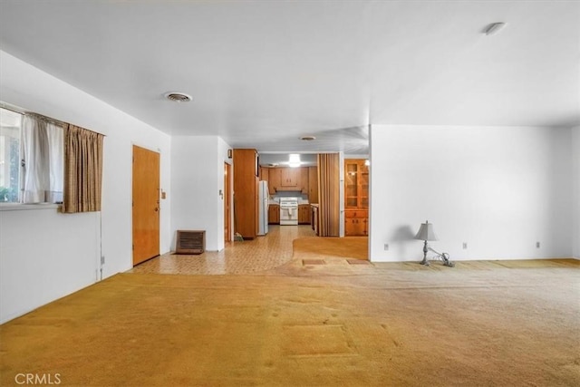 13411 Wingo St, Arleta, CA 91331 - unfurnished living room featuring light carpet
