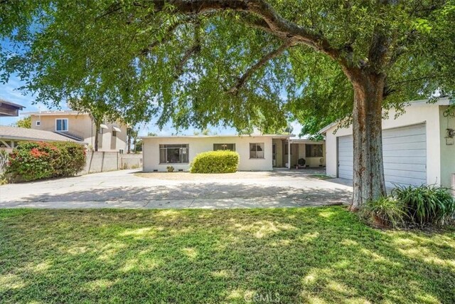 13411 Wingo St, Arleta, CA 91331 - ranch-style house with driveway and stucco siding