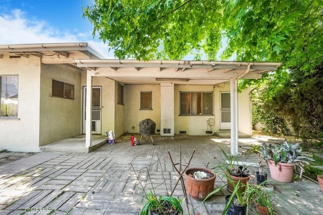 13411 Wingo St, Arleta, CA 91331 - rear view of property with stucco siding and a patio