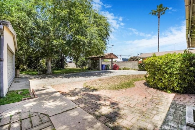13411 Wingo St, Arleta, CA 91331 - view of patio with driveway and a carport