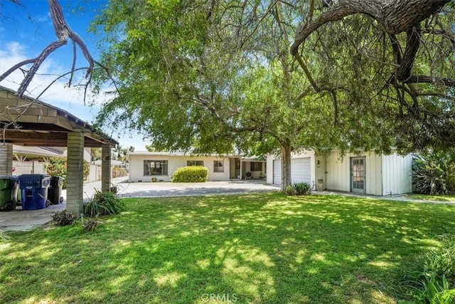 13411 Wingo St, Arleta, CA 91331 - view of grassy yard with an attached garage