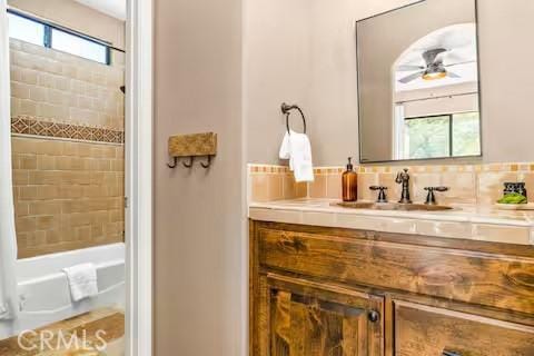 62398 Cope Ln, Joshua Tree, CA 92252 - full bath featuring a ceiling fan, vanity, and tasteful backsplash
