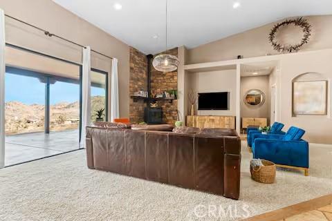 62398 Cope Ln, Joshua Tree, CA 92252 - carpeted living area featuring vaulted ceiling