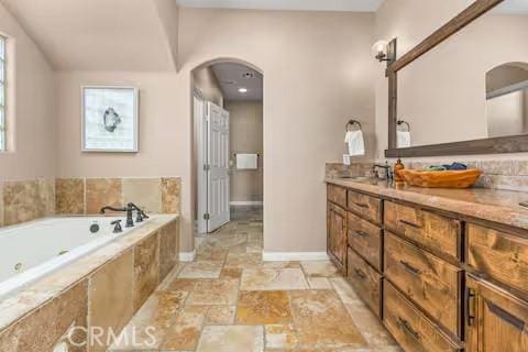 62398 Cope Ln, Joshua Tree, CA 92252 - full bath with a bath, baseboards, stone tile flooring, and vanity