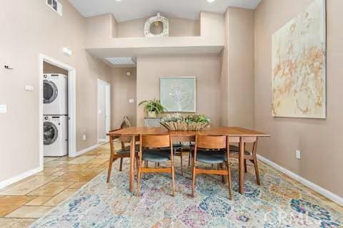 62398 Cope Ln, Joshua Tree, CA 92252 - dining space featuring stacked washer and clothes dryer and baseboards