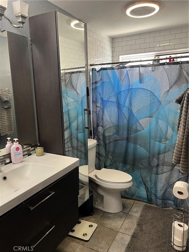 111 W Perry St, Perris, CA 92571 - bathroom with vanity, toilet, curtained shower, tile patterned flooring, and a textured ceiling