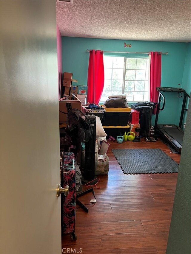 111 W Perry St, Perris, CA 92571 - office area featuring hardwood / wood-style floors and a textured ceiling
