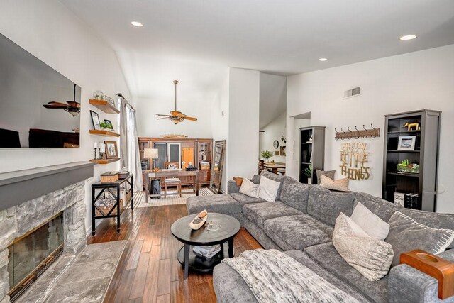 22206 Claibourne Ln, Saugus, CA 91350 - living area with ceiling fan, dark wood finished floors, a fireplace, recessed lighting, and high vaulted ceiling