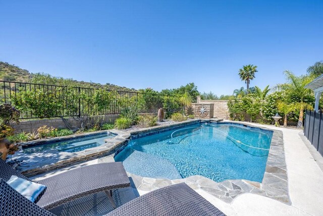 22206 Claibourne Ln, Saugus, CA 91350 - view of swimming pool with a fenced backyard and a pool with connected hot tub