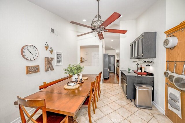 22206 Claibourne Ln, Saugus, CA 91350 - dining area featuring a ceiling fan, high vaulted ceiling, light tile patterned floors, recessed lighting, and baseboards