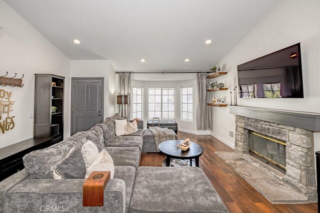 22206 Claibourne Ln, Saugus, CA 91350 - living area with lofted ceiling, a fireplace, recessed lighting, dark wood finished floors, and baseboards