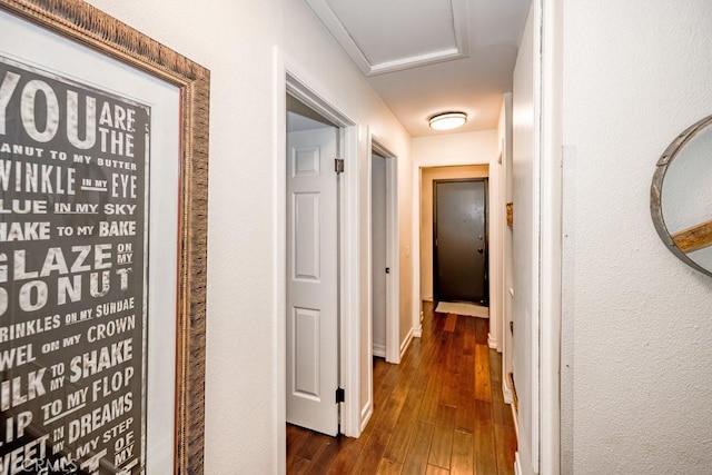 22206 Claibourne Ln, Saugus, CA 91350 - hallway featuring dark wood-style floors and attic access
