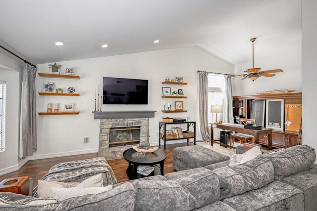 22206 Claibourne Ln, Saugus, CA 91350 - living room featuring vaulted ceiling, wood finished floors, a stone fireplace, baseboards, and ceiling fan