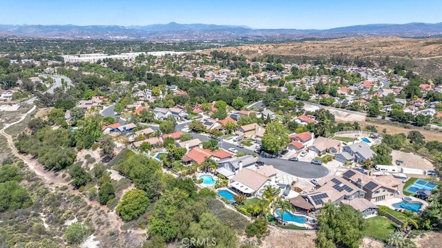 22206 Claibourne Ln, Saugus, CA 91350 - aerial view of property and surrounding area featuring a pool and a mountainous background