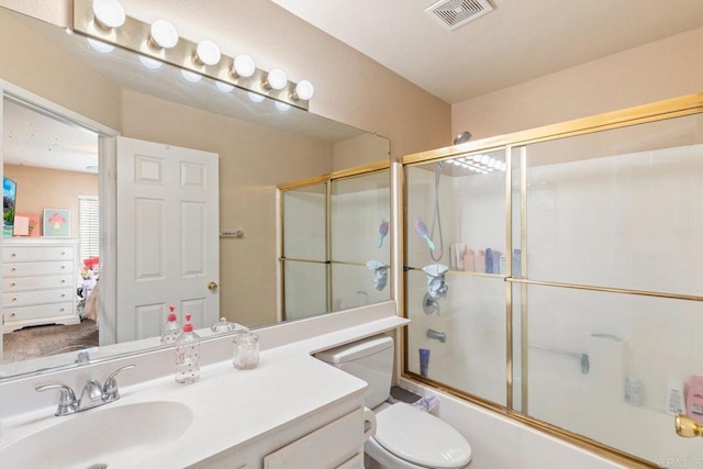 29495 Cara Way, Temecula, CA 92591 - bathroom featuring shower / bath combination with glass door, vanity, and toilet