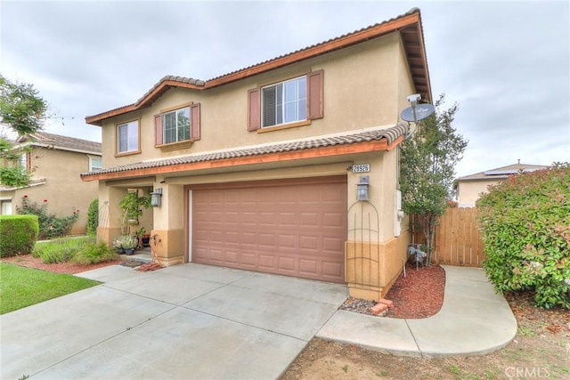 28926 Lavatera Ave, Murrieta, CA 92563 - mediterranean / spanish-style home featuring an attached garage, stucco siding, a tile roof, and concrete driveway