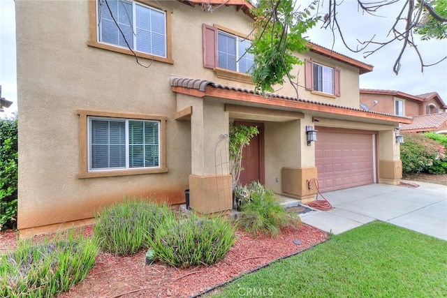 28926 Lavatera Ave, Murrieta, CA 92563 - mediterranean / spanish-style house with stucco siding, concrete driveway, and a garage