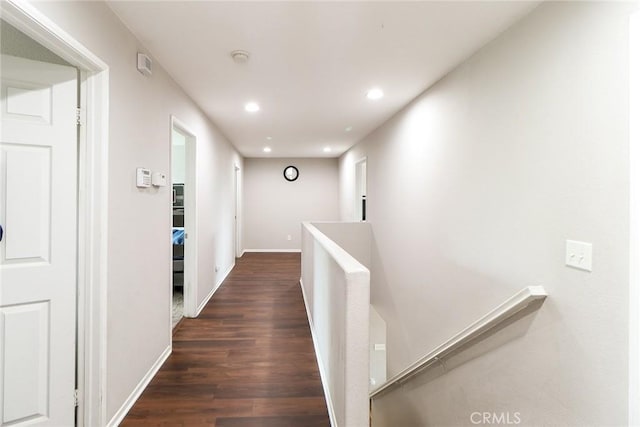 28926 Lavatera Ave, Murrieta, CA 92563 - hallway featuring an upstairs landing, dark wood-type flooring, recessed lighting, and baseboards
