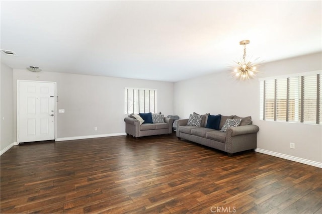 28926 Lavatera Ave, Murrieta, CA 92563 - living area with a chandelier, dark wood-style flooring, and baseboards