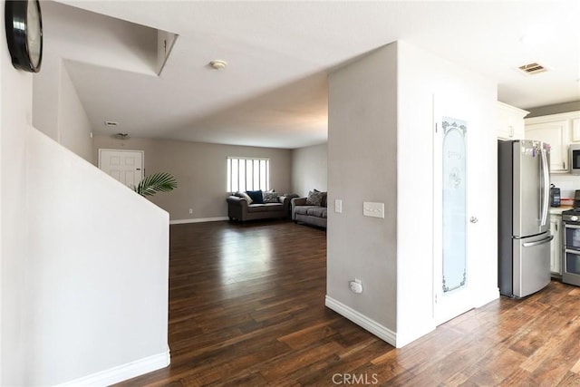 28926 Lavatera Ave, Murrieta, CA 92563 - hallway featuring dark wood-style floors and baseboards