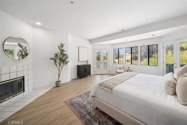 667 Hill St, San Luis Obispo, CA 93405 - bedroom with french doors, access to exterior, wood finished floors, and recessed lighting
