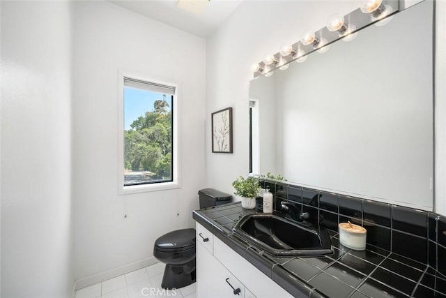 667 Hill St, San Luis Obispo, CA 93405 - bathroom with vanity, toilet, tile patterned flooring, and baseboards