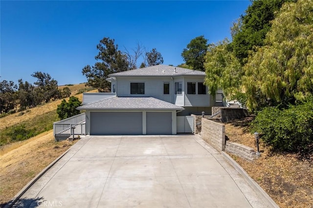 667 Hill St, San Luis Obispo, CA 93405 - view of front facade featuring driveway, a shingled roof, and a garage