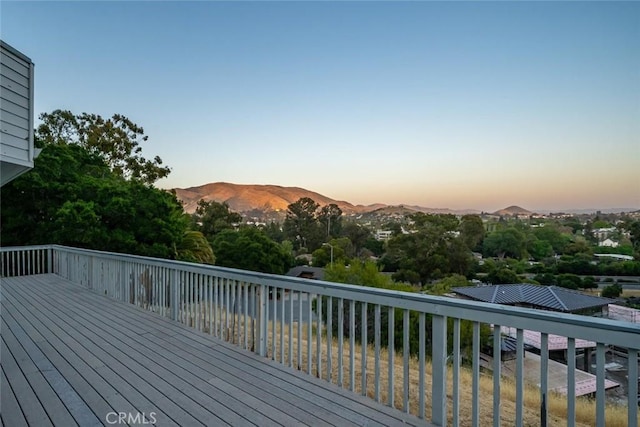 667 Hill St, San Luis Obispo, CA 93405 - deck at dusk featuring a mountain view and view of scattered trees