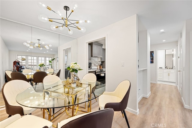 906 N Doheny Dr Unit 318, West Hollywood, CA 90069 - dining room with a chandelier, light wood-style flooring, baseboards, and recessed lighting