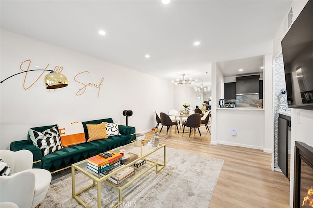 906 N Doheny Dr Unit 318, West Hollywood, CA 90069 - living area featuring light wood-style flooring, recessed lighting, a chandelier, beverage cooler, and baseboards