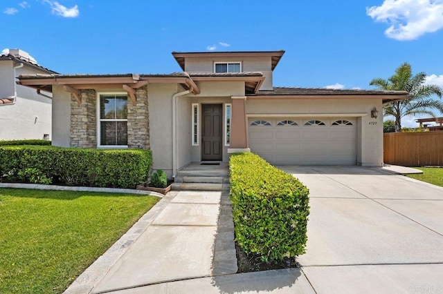 4729 Crater Rim Rd, Carlsbad, CA 92010 - view of front of property with a garage, stucco siding, concrete driveway, and stone siding