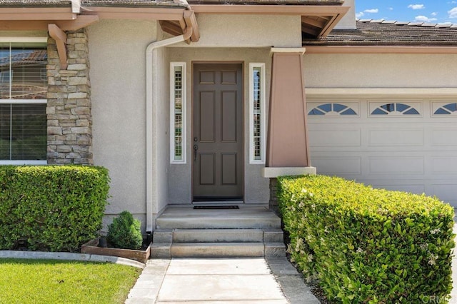 4729 Crater Rim Rd, Carlsbad, CA 92010 - property entrance featuring stucco siding and an attached garage