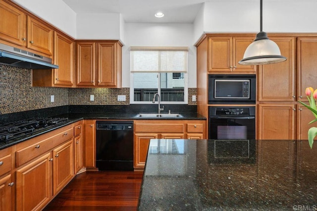 4729 Crater Rim Rd, Carlsbad, CA 92010 - kitchen with a sink, black appliances, under cabinet range hood, brown cabinetry, and backsplash