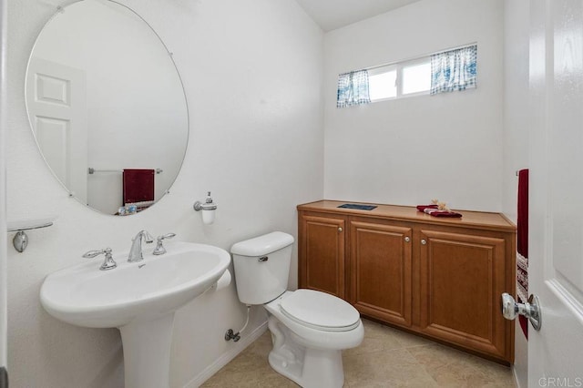 4729 Crater Rim Rd, Carlsbad, CA 92010 - half bath with toilet, baseboards, and tile patterned floors