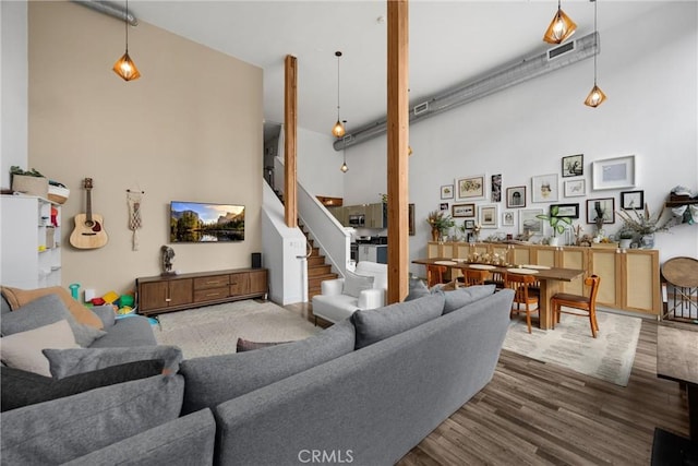 4215 Glencoe Ave Unit 103, Marina Del Rey, CA 90292 - living room with a high ceiling, wood finished floors, and stairs