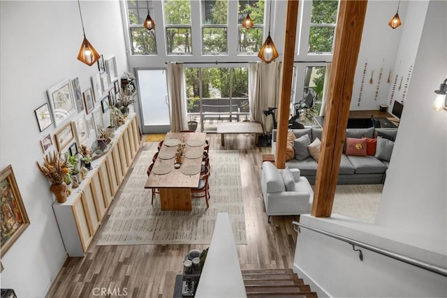 4215 Glencoe Ave Unit 103, Marina Del Rey, CA 90292 - living room with a towering ceiling and wood finished floors