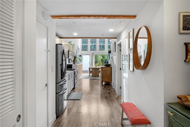 4215 Glencoe Ave Unit 103, Marina Del Rey, CA 90292 - kitchen featuring stainless steel appliances, beamed ceiling, light wood-style flooring, and recessed lighting