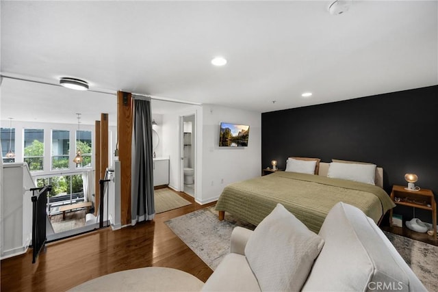 4215 Glencoe Ave Unit 103, Marina Del Rey, CA 90292 - bedroom with wood finished floors, recessed lighting, baseboards, and ensuite bathroom