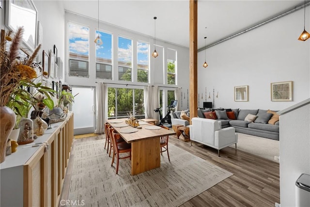 4215 Glencoe Ave Unit 103, Marina Del Rey, CA 90292 - dining room featuring a high ceiling and light wood-type flooring