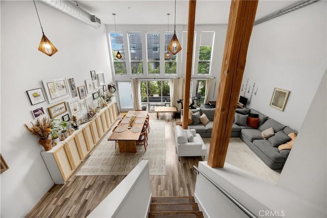 4215 Glencoe Ave Unit 103, Marina Del Rey, CA 90292 - living area featuring dark wood-style floors and a towering ceiling