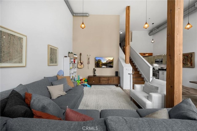 4215 Glencoe Ave Unit 103, Marina Del Rey, CA 90292 - living room featuring stairs and a towering ceiling