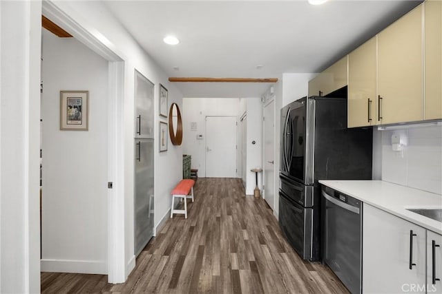 4215 Glencoe Ave Unit 103, Marina Del Rey, CA 90292 - kitchen featuring appliances with stainless steel finishes, cream cabinetry, wood finished floors, light countertops, and baseboards