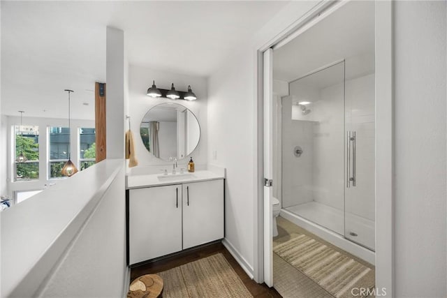 4215 Glencoe Ave Unit 103, Marina Del Rey, CA 90292 - full bathroom featuring a stall shower, toilet, vanity, and wood finished floors