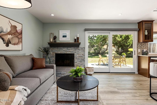 2365 Henrietta Ave, La Crescenta, CA 91214 - living room featuring light wood-style flooring, recessed lighting, and a stone fireplace