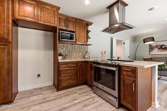 2365 Henrietta Ave, La Crescenta, CA 91214 - kitchen with appliances with stainless steel finishes, island exhaust hood, a peninsula, decorative backsplash, and light wood-style flooring
