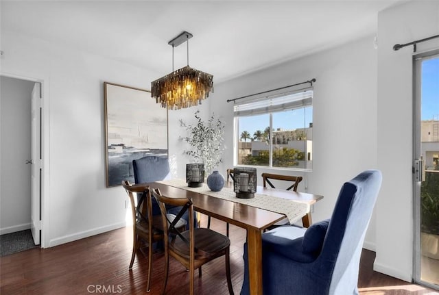 1914 Corinth Ave Unit 201, Los Angeles, CA 90025 - dining space featuring a chandelier, wood finished floors, and baseboards